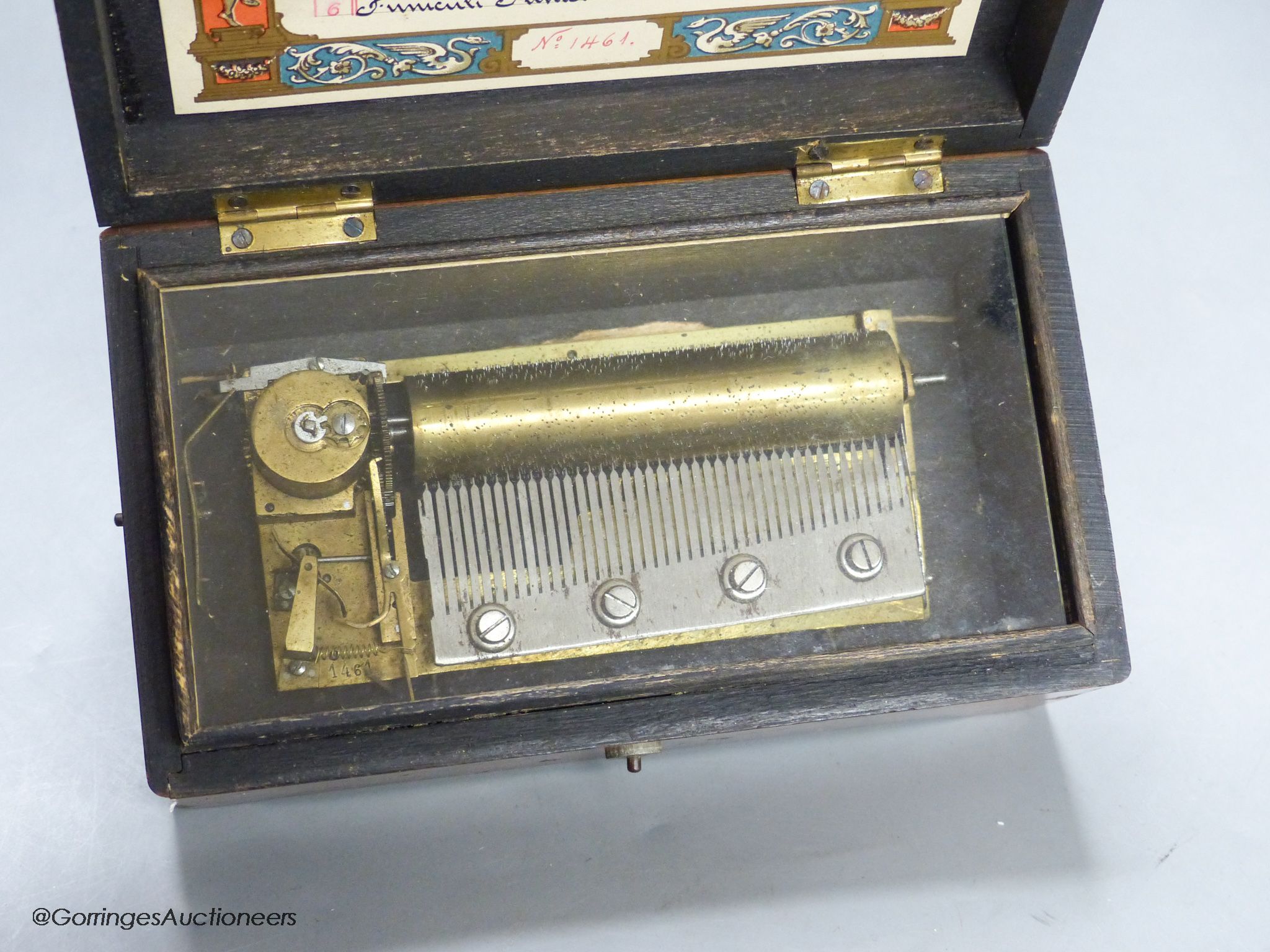 A small Swiss amboyna six air cylinder musical box